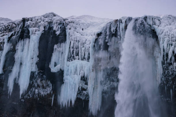 istock Beautiful Seljalandsfoss waterfall and surrounding area in winter (South Iceland) 2204747323