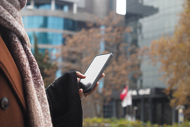 istock A person is engaged in using a smartphone while outdoors in an urban environment setting 2204747509