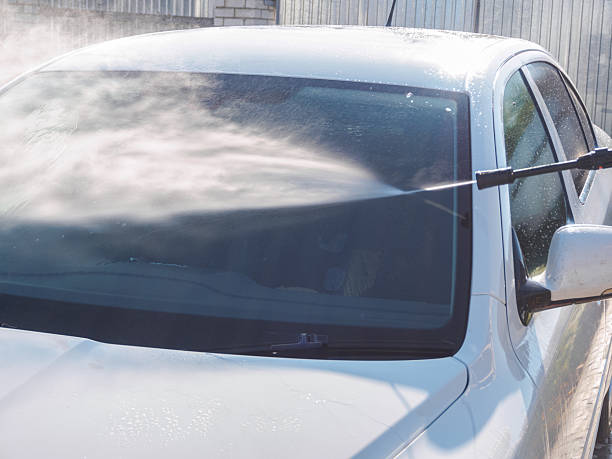 istock Manual car high-pressure wash using equipment for effective dirt removal and coating protection. 2204748642