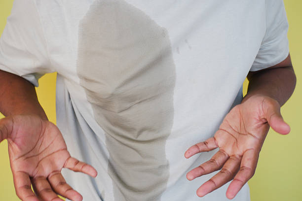 istock man hands with spilled water over his shirt 2204750307