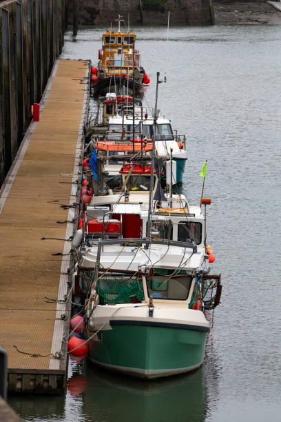 istock Fishing boats moored at Padstow Harbour. 2204752037