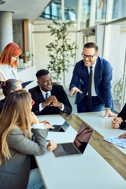 Professional Business Team Collaborating During a Meeting in a Modern Office Setting stock photo
