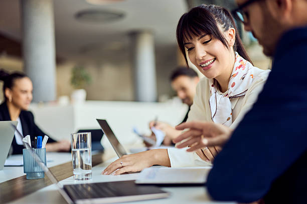 istock Professional Team Meeting with Smiling Colleagues Collaborating in a Modern Office Space 2204752339
