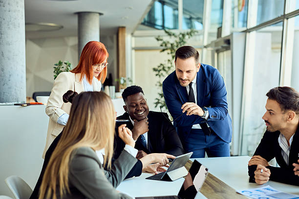 istock Team Collaborating in Modern Office Setting During Professional Business Meeting 2204755282