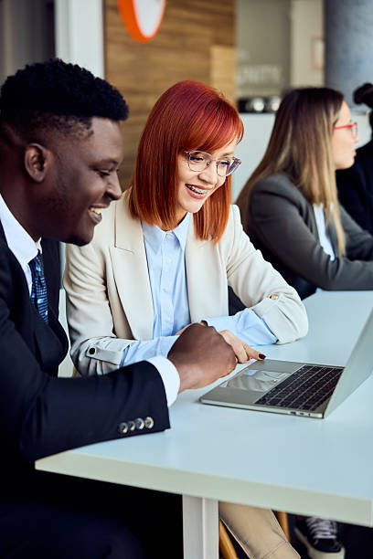 istock Team Collaboration at a Modern Office Setting Focused Around a Laptop Discussion 2204755291