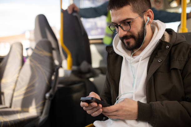 istock Tech-Savvy Passenger on a City Bus 2204755540