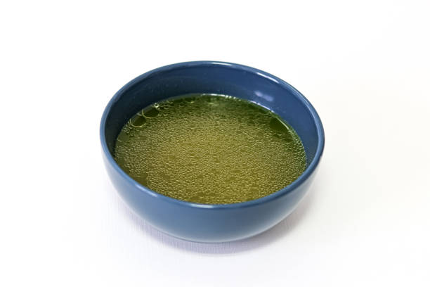 Nutrition. Blue bowl with soup on white background.