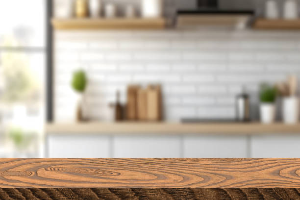 istock Wood table top on blur kitchen room background. For montage product display or design key visual layout. 2204756487
