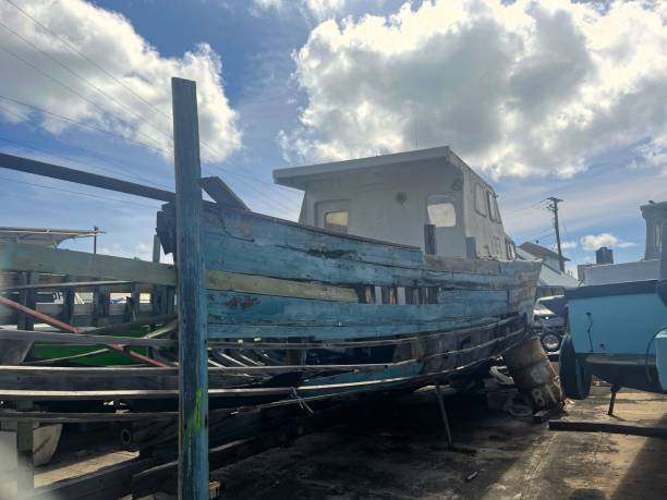 istock An old wooden decrepit boat in a storage yard. 2204756620
