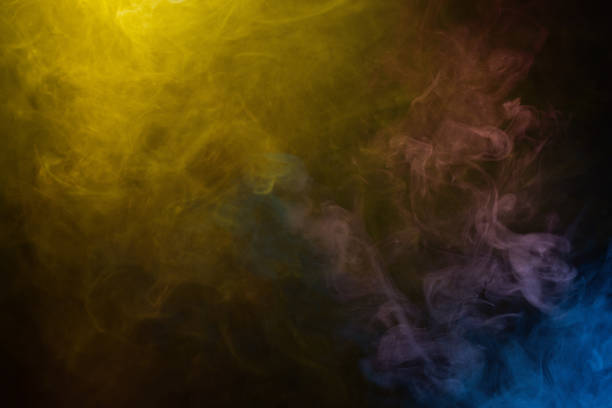 istock Yellow and pink steam on a black background. 2204756668