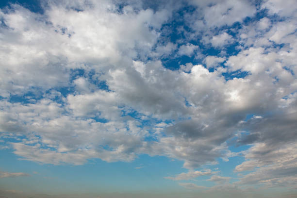 istock Natural and cloudy fresh blue sky background. Natural sky beautiful blue and white texture background. Blue sky and cloud on summer daytime. Blue sky and white clouds of daytime 2204757171