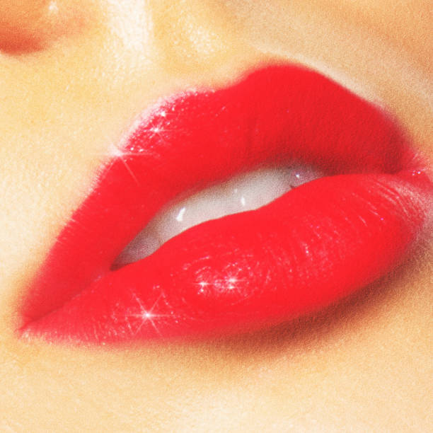 istock Close-up red woman lips with sparkles 2204757206