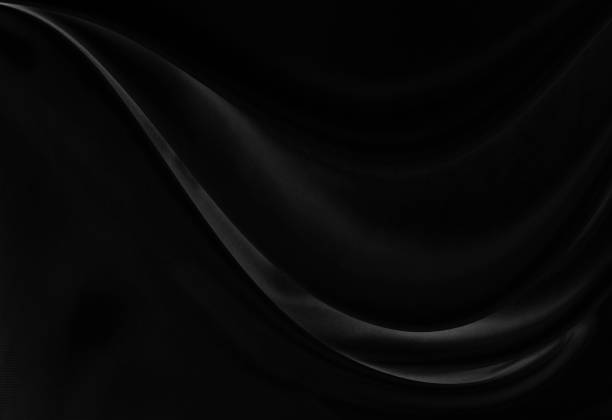 istock Black gray satin dark fabric texture luxurious shiny that is abstract silk cloth background with patterns soft waves blur beautiful. 2204760877
