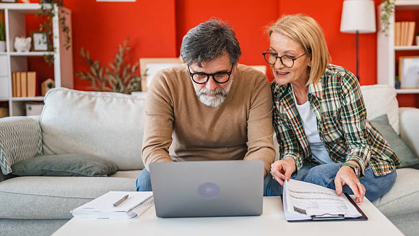 istock two colleague work from home together planning and research on laptop 2204762440