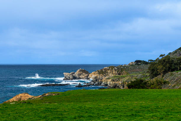 High angle view of rocky shore and crashing ocean waves along the Big Sur coast.Taken at from California Highway One, Big Sur, California, USA