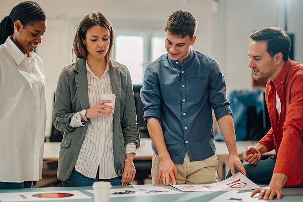 istock Marketing team analyzing charts and discussing new strategy during a meeting 2204767425