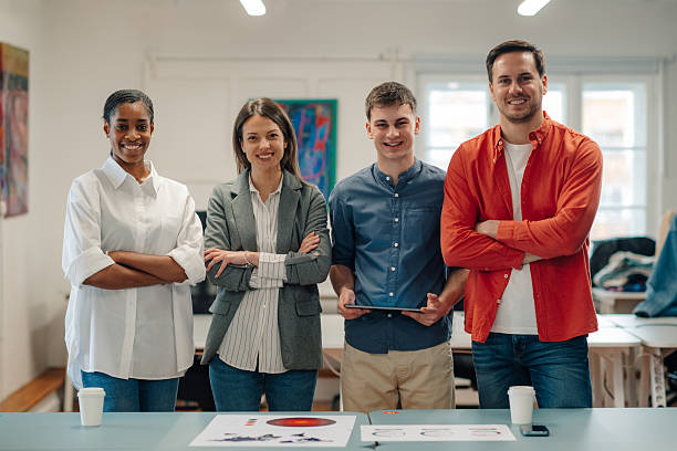 istock Startup business team smiling with folded arms in office 2204767641
