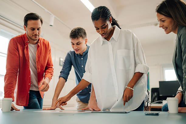 istock Business team analyzing charts and reports in modern office 2204767654