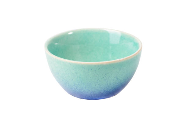 istock Light blue and turquoise ceramic bowl with speckled glaze isolated on white background perfect for serving and displaying food, sauces, candies 2204774919