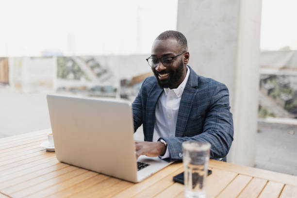 istock Focused Professional Working on Laptop Outside 2204774937
