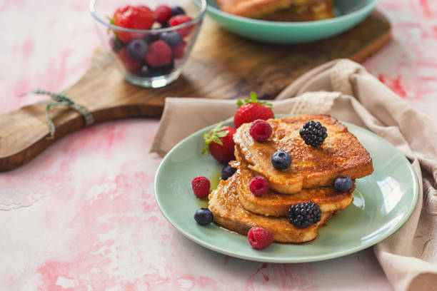 istock French Toast with Berries and Maple Syrup 2204778843