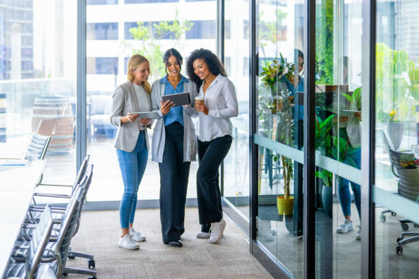 istock Three business women working looking at digital tablets 2204778886