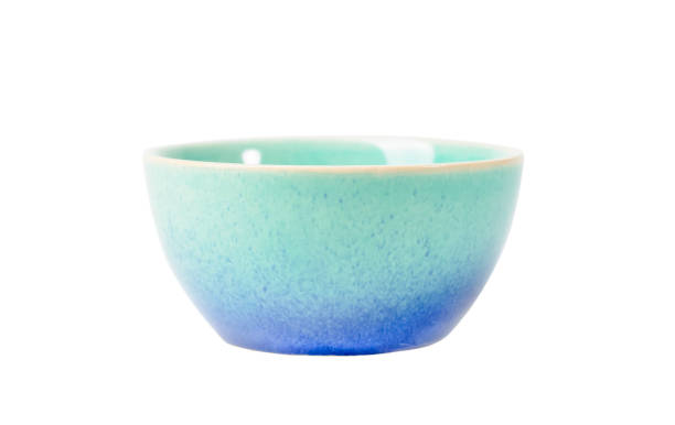 istock Light blue and turquoise ceramic bowl with speckled glaze isolated on white background perfect for serving and displaying food, sauces, candies, close up front view 2204778976