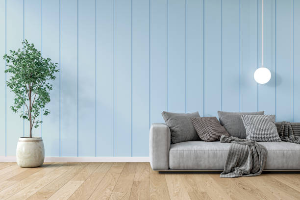 istock Modern interior: a living room with a gray sofa, light blue paneled accent wall background and decoration 2204779320