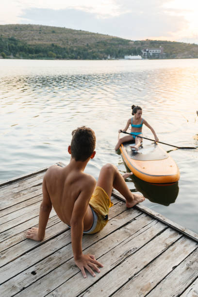 istock Peaceful Moments by the Lake: Paddleboard Adventure 2204786656
