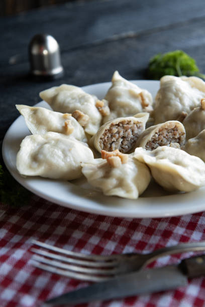Delicious dumplings with tasty filling on plate.