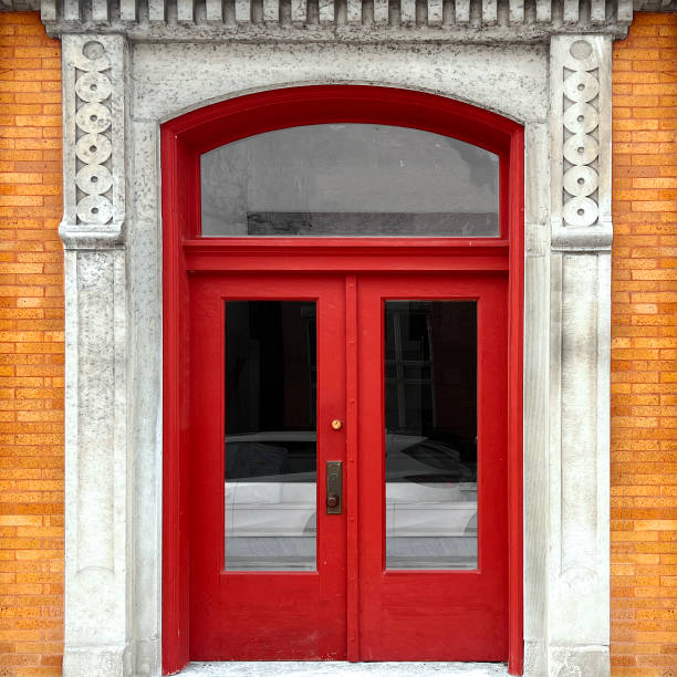 istock Vintage Red Double Door with Ornate Stone Archway 2204795555