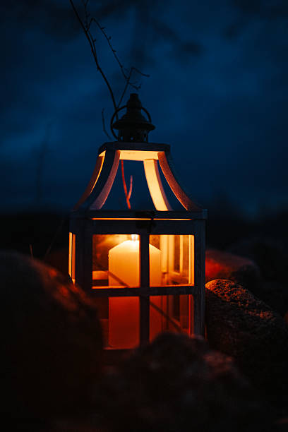 istock Glowing Lantern with Candle in a Dark Outdoor Setting at Night 2204795698