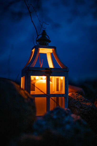 istock Glowing Lantern with Candle in a Dark Outdoor Setting at Night 2204795722