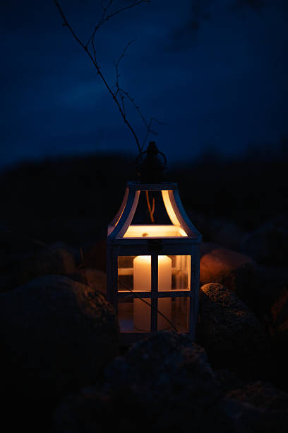 istock Glowing Lantern with Candle in a Dark Outdoor Setting at Night 2204798080