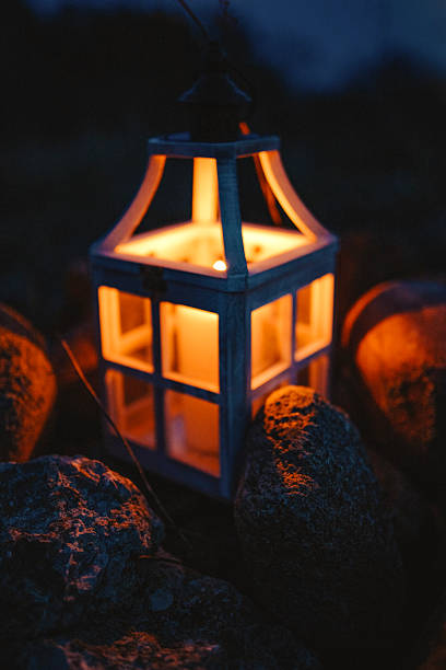 istock Glowing Lantern with Candle in a Dark Outdoor Setting at Night 2204798093