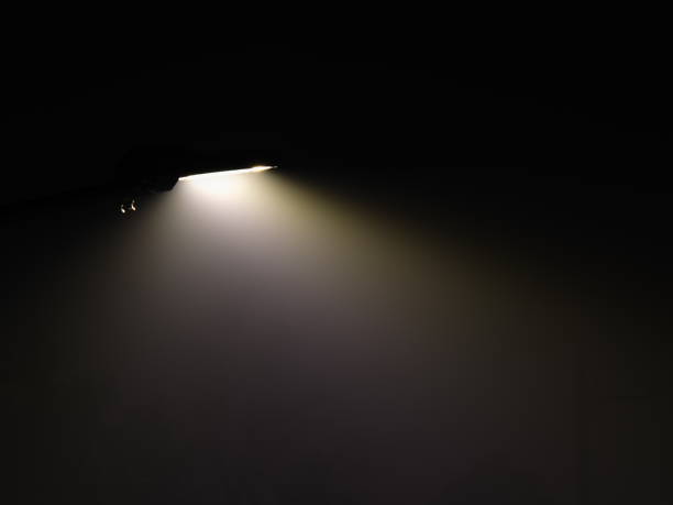 istock Deep fog  illuminated with street light 2204800176