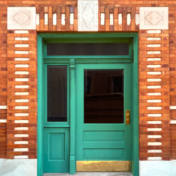 istock Vintage Green Door with Decorative Brickwork 2204801314