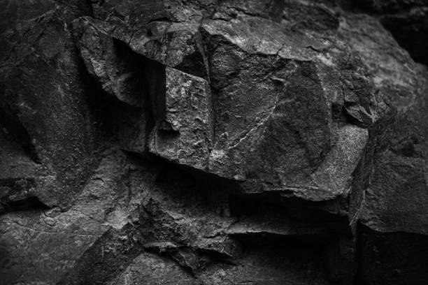 istock Black white dark stone rock granite background. Mountain surface texture. Close-up. For design. 2204807081