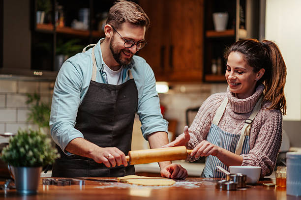 istock Couple enjoying baking together in cozy kitchen 2204807808