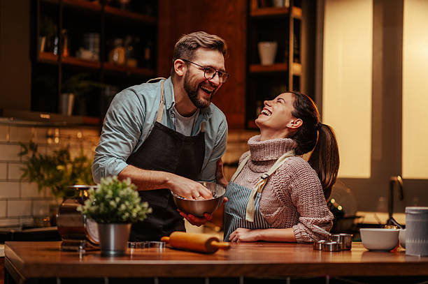 istock Couple enjoying cooking together in kitchen 2204807818