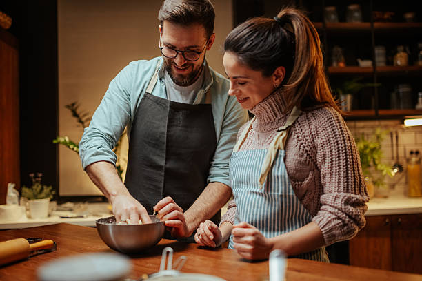 istock Couple enjoying baking together in cozy kitchen 2204807825