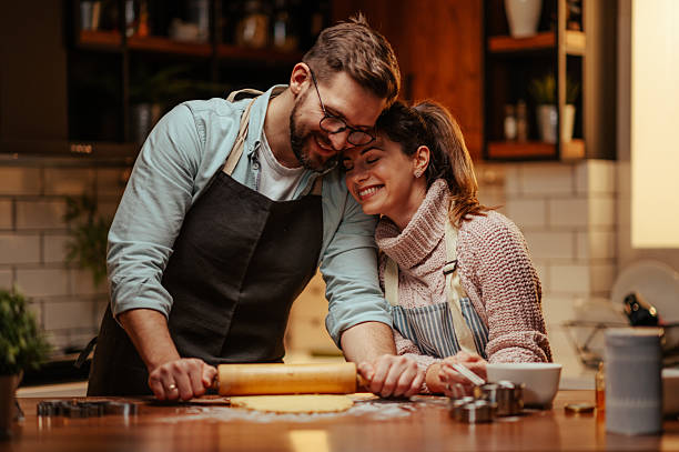 istock Couple enjoying baking together in cozy kitchen 2204807826