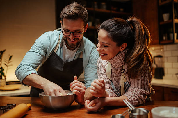 istock Couple enjoying baking together in cozy kitchen 2204807844