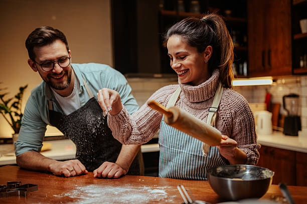 istock Couple enjoying baking together in cozy kitchen 2204807867