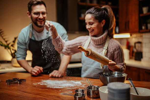 istock Couple enjoying baking together in cozy kitchen 2204807877