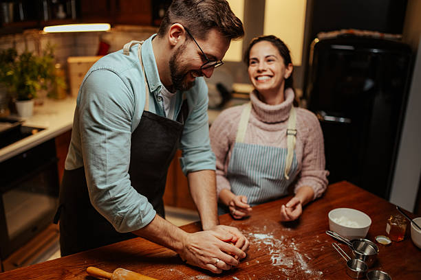 Couple enjoying baking together in cozy kitchen