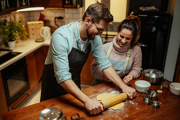 istock Couple enjoying baking together in cozy kitchen 2204807889