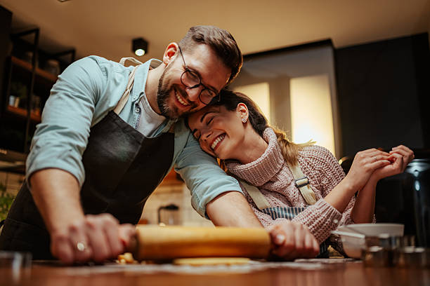 istock Couple enjoying baking together in cozy kitchen 2204807895