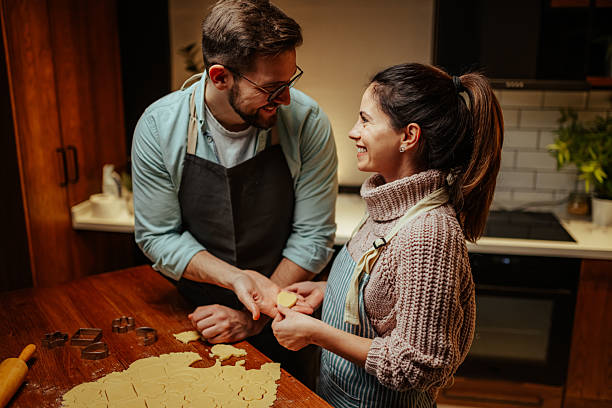 istock Couple enjoying baking together in cozy kitchen 2204807903