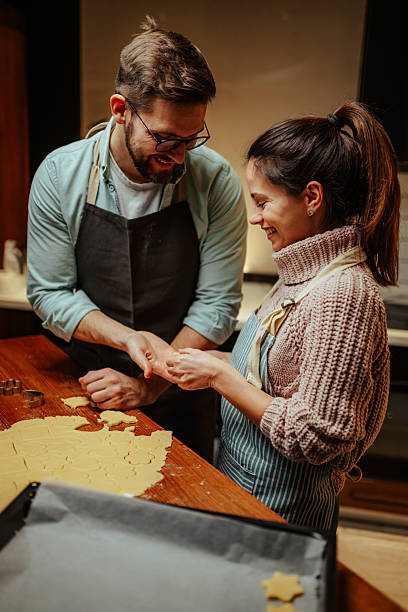 istock Couple enjoying baking together in cozy kitchen 2204807913